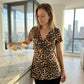 🐆 50% OFF NOW! 👗 Women's V-Neck Twist-Front Leopard Print Top – Flowy Peplum Hem, Soft Polyester & Flattering Silhouette – Effortless Edge 🌿